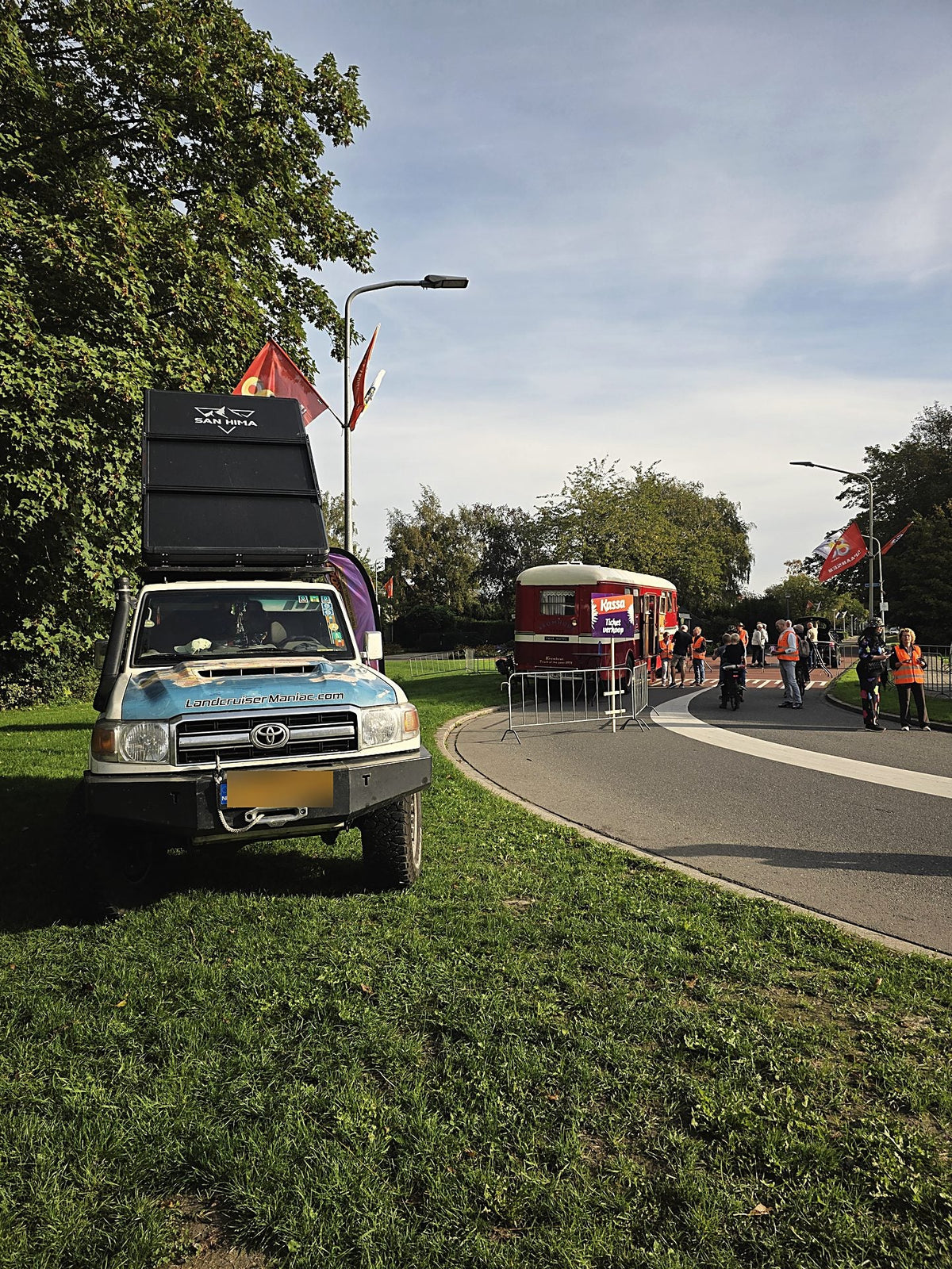 Land Cruiser with the LCM hardshell rooftop tent closed at an event