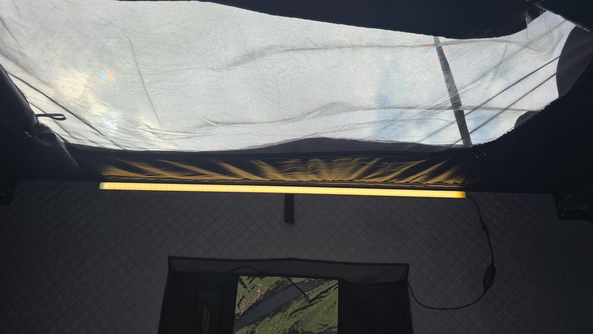 LED strip lighting and mesh roof window in the LCM Offroad Oasis hardshell rooftop tent